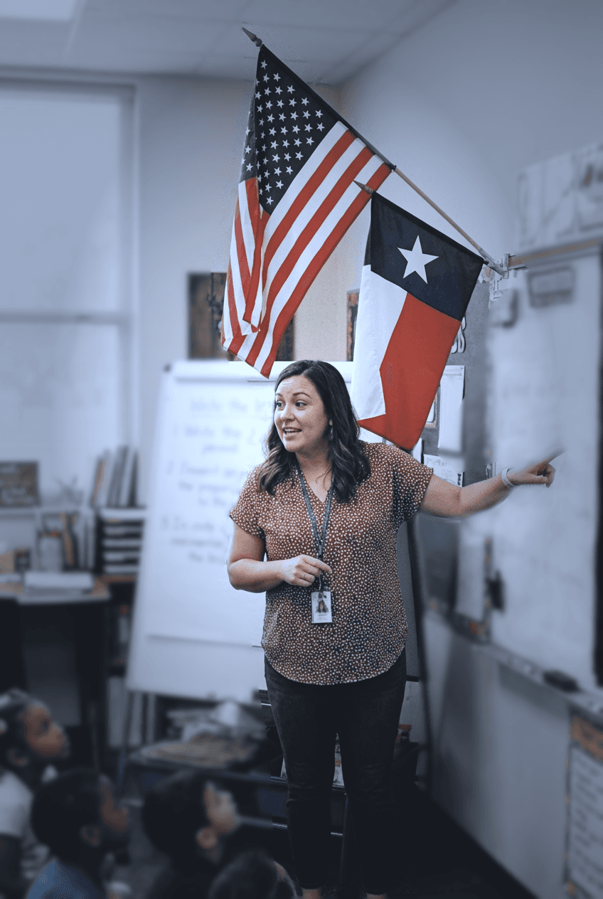 Texas elementary classroom with teacher at whiteboard engaging diverse students during a T-TESS observation